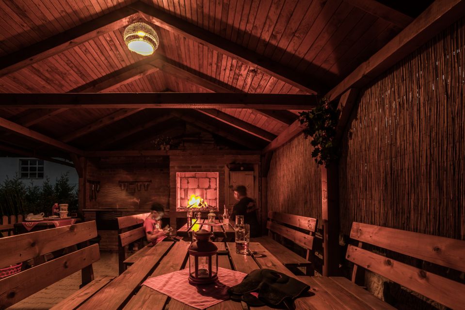 Wooden cabin with seating and an open fire