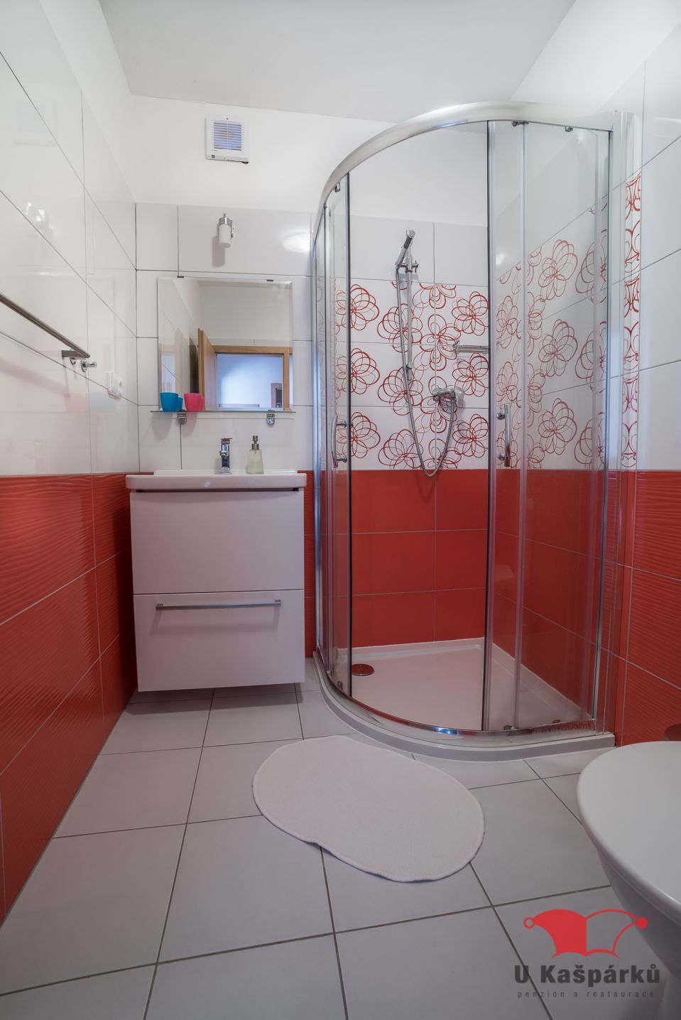 Bathroom with a shower cubicle and washbasin