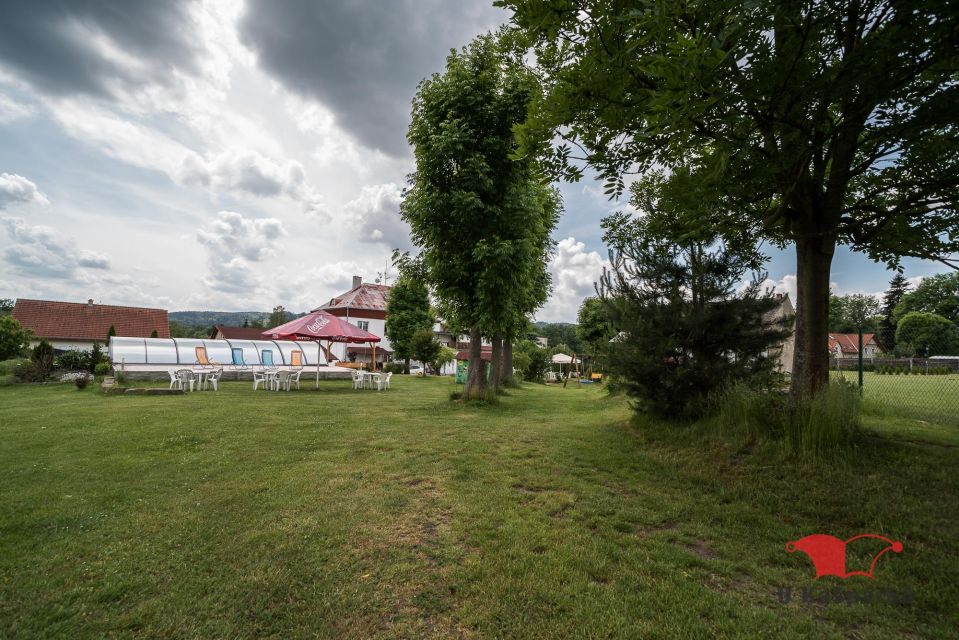 Meadow and mature trees behind the guesthouse