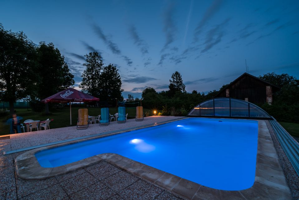 The lit covered pool at dusk