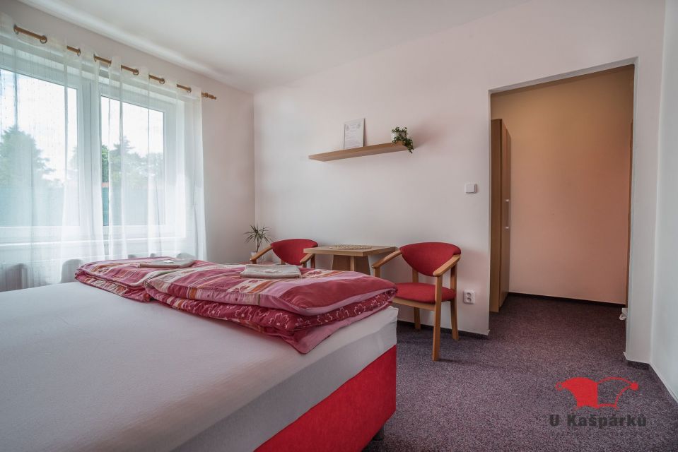Double room with a double bed and seating by the window