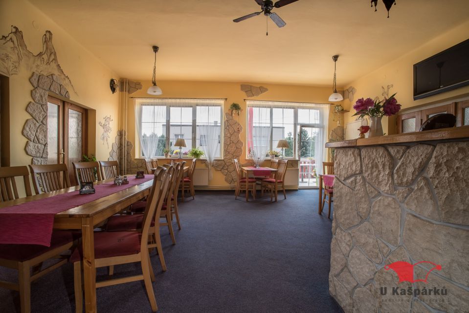 Dining room with large windows and a laid table