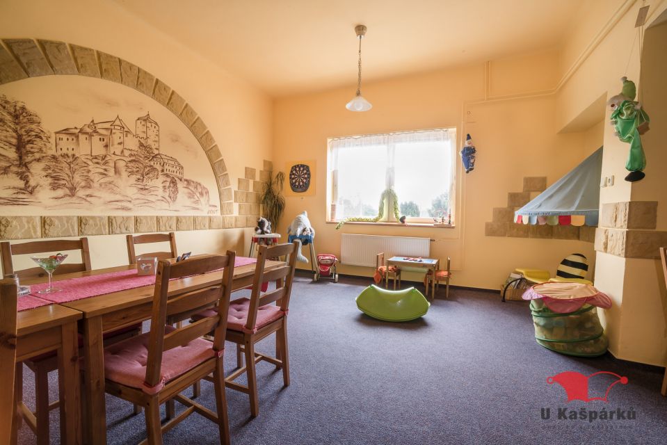 Side room with a wall mural and beanbags